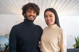 happy-young-man-and-woman-looking-at-camera-2023-11-27-04-49-07-utc